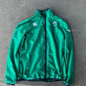Green windbreaker with black around the edges